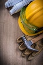 Claw hammer goggles construction plans hard hat and safety glove Royalty Free Stock Photo