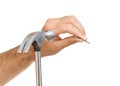 Claw hammer and hand with nail Royalty Free Stock Photo