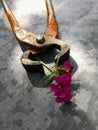 Claw hammer, pliers, and a flower. Set of different tools on metal background with flowers Royalty Free Stock Photo