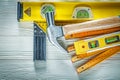 Claw hammer wooden meter construction level try square on white Royalty Free Stock Photo