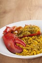 Clawed Lobster with yellow rice Royalty Free Stock Photo