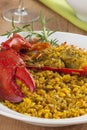 Clawed Lobster with yellow rice Royalty Free Stock Photo