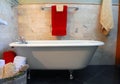 Clawfoot tub in bathroom. Spa setting. Royalty Free Stock Photo