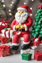 Clay art of a christmas showing a santa claus around xmas ornaments Royalty Free Stock Photo