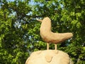 Clay bird in park near trees, Lithuania