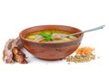 Clay bowl with lentil soup and smoked pork ribs Royalty Free Stock Photo