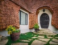 The Clay Castle from the Valley of Fairies, a touristic complex in Transylvania, Romania. Closeup view to a tiny entrance door,