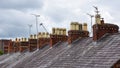 Clay chimney pots on rooftops Royalty Free Stock Photo