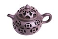 Clay Chinese teapot with carved patterns isolated on a white background