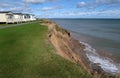 Clay cliff erosion by sea. Royalty Free Stock Photo