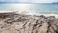 Clay coast of Dead Sea in winter day Royalty Free Stock Photo