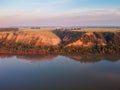 Clay coast with groves of birch trees, soil erosion Royalty Free Stock Photo