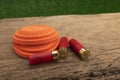 Clay disc flying targets and shotgun bullets on wooden table background ,Clay Pigeon target game