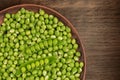 Clay dish full of fresh peas. Copy space Royalty Free Stock Photo