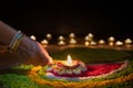 Clay diya lamps lit during diwali celebration, Diwali, or Dipawali, is India\'s biggest and most important holiday