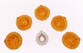 Clay diya or oil lamps on white background