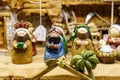 Clay figures representing the three kings of the east in a traditional nativity scene.