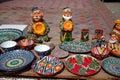 Clay figurines of Uzbeks and ornamented dishes for pilaf. Souvenirs of Uzbekistan. National art. April 29, 2019