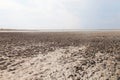 Clay in flat plain, steppe, salt, salt lake, heat and sky