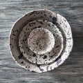 Clay handcraft empty gray bowls, covered with glazed a gray wooden background with copy space. Flat lay Royalty Free Stock Photo