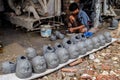 The clay idol maker of Hindu goddess is busy making heads.