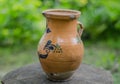 Clay jug. Girl holds a jug of water. Dishes.