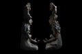 Clay-made Mayan sculptures of ancient shamans of Jaina island isolated on a black background