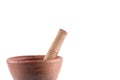 Clay mortar and wood pestle is a kitchen used to make papaya salad on white background cooking kitchenware object isolated Royalty Free Stock Photo