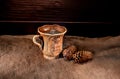 Clay mug with tea on the burlap with a dark background Royalty Free Stock Photo