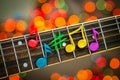 Clay notes on strings of guitar Royalty Free Stock Photo