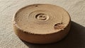 Clay object with a rough texture featuring a concentric circular Royalty Free Stock Photo