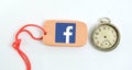 Clay plate and vintage clock with logo of facebook Royalty Free Stock Photo