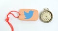 clay plate and vintage clock with logo of twitter