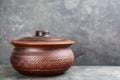 Clay pot on grey table. Space for text Royalty Free Stock Photo
