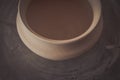 Clay pot on a potter`s wheel Royalty Free Stock Photo