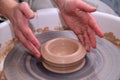 Clay pot on a potter wheel and hands Royalty Free Stock Photo