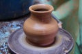 Clay pot on a pottery wheel