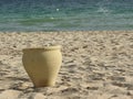 Clay pot stands on the sand by the sea, Africa Royalty Free Stock Photo