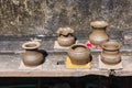 Clay pots made by hand of Thai traditional pottery jar placed in the outdoor to the sun of villages at Ko Kret. Royalty Free Stock Photo