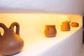 Clay pots on the shelf in the kitchen. Ceramic ware, Royalty Free Stock Photo