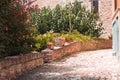 Clay pots and vases with plants and flowers in a courtyard of a medieval italian village Pesaro, Italy Royalty Free Stock Photo