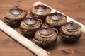 Clay pots on a wooden table and napkins Royalty Free Stock Photo