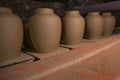 Clay pottery ceramic Products dry on shelf in workshop Royalty Free Stock Photo