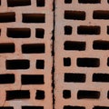 Clay red brick close-uo macro texture. Construction brick isolate on white Royalty Free Stock Photo