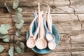 Clay spoons in ceramic bowl flat lay