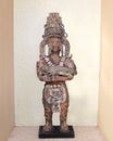 Clay statue ancient Mayan holding an iguana