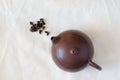 Clay teapot and gaba tea from Taiwan on linen background. Top view