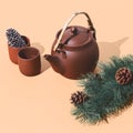 Clay teapot and pine branch in isometry. Still life scene. Winter time christmas concept