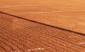 Clay tennis court with a net shadow on it. Outdoor red tennis court. Background, texture, space for text Royalty Free Stock Photo