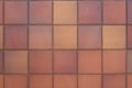 Clay Tile Flooring texture. Clay tiles. Red stone clay quarry tiled floor detail. Aged tiles square clay orange floor. tiled floor Royalty Free Stock Photo